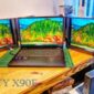 KYY X90E sebuah portable monitor triple screen berukuran 15,6 inci.