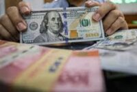 Ilustrasi pembagian dividen tunai BBNI dan BBCA,